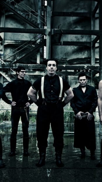 Rammstein Wallpapers showing the band members in black outfits inside a gritty industrial area, HD Phone Wallpaper