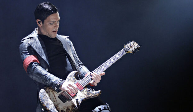 A Rammstein guitarist is playing an electric guitar during a live performance, HD Desktop Wallpaper