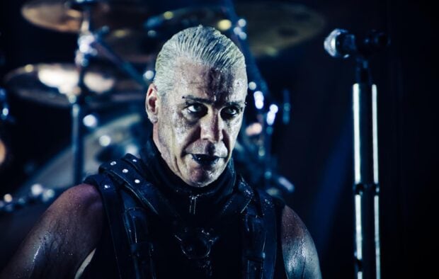 A close up of a Rammstein band member during an intense stage performance, HD Desktop Wallpaper