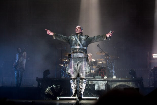 The Rammstein lead singer stands with arms outstretched during a live concert performance, HD Desktop Wallpaper