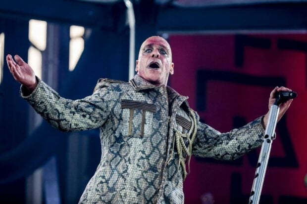 The lead singer of Rammstein is performing live on stage with dramatic makeup, HD Desktop Wallpaper