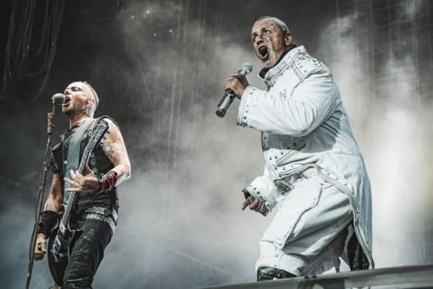 Rammstein performs energetically on stage with intense expressions, HD Desktop Wallpaper