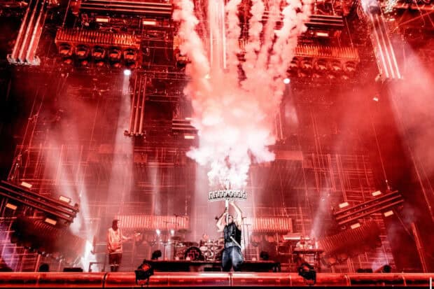 A concert stage shows Rammstein performing with dramatic fire effects and lighting, HD Desktop Wallpaper