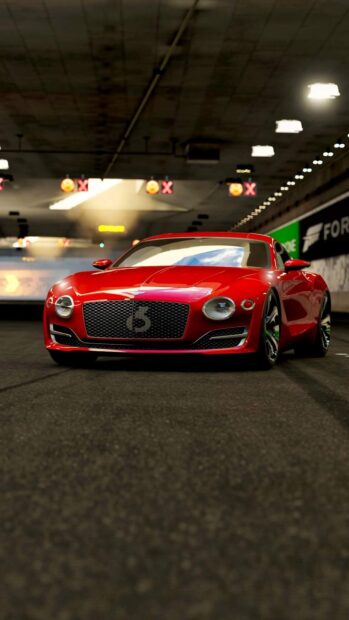 A red Bentley Continental GT is driving inside a tunnel with bright lights above, HD Phone Wallpaper