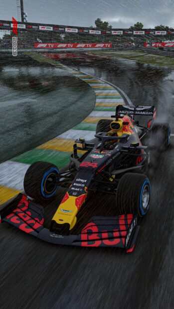 A Red Bull Formula 1 car speeds on a wet race track under rainy conditions with tire spray, HD Phone Wallpaper