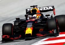A Red Bull Racing F1 car races on a circuit during an F1 event, 4K Desktop Wallpaper