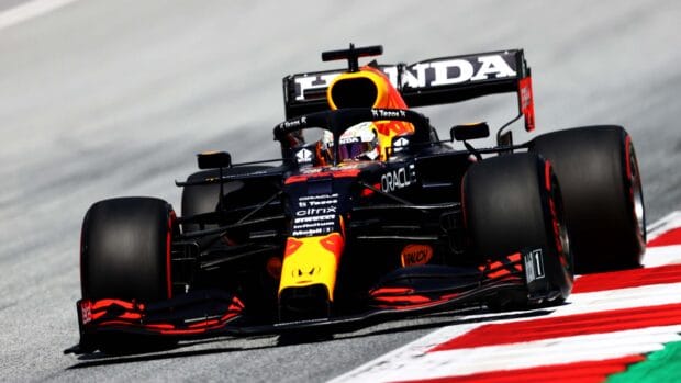 A Red Bull Racing F1 car races on a circuit during an F1 event, 4K Desktop Wallpaper