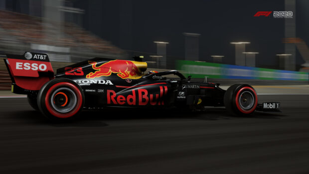 A Red Bull Racing car races fast on a night circuit during an F1 competition, 2K Desktop Wallpaper
