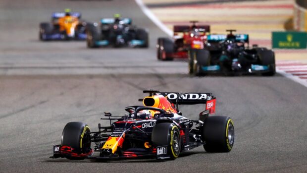 A Red Bull Racing Formula 1 car leads the pack on the racetrack at high speed, HD Desktop Wallpaper