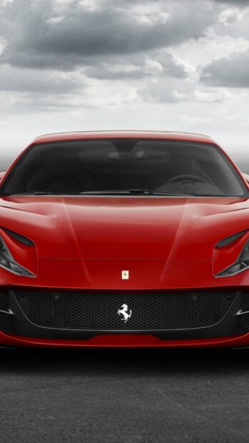 The red Ferrari 812 GTS car is shown from the front with a cloudy sky in the background, HD Mobile Wallpaper