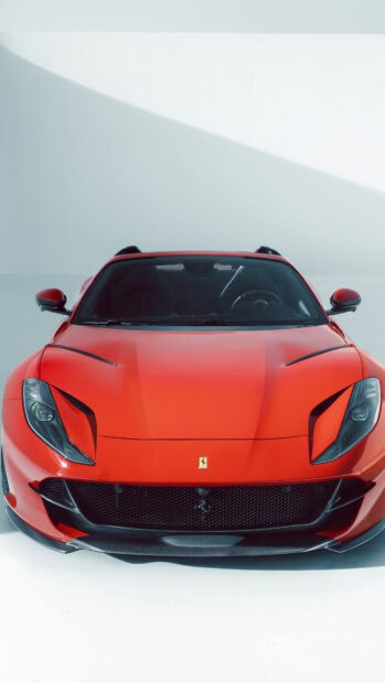 A red Ferrari 812 Gts is shown from the front with clear details of its headlights and grille, 4K Phone Wallpaper