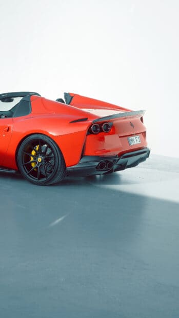 A red Ferrari 812 Gts is captured from the rear showcasing its sleek design and black rims, 4K Mobile Wallpaper