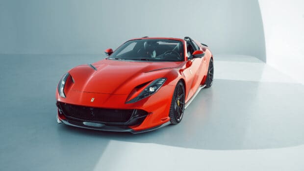 A sleek red Ferrari 812 Gts with its top down is displayed in a studio setting, 4K Desktop Wallpaper