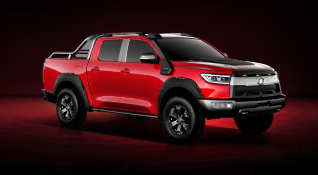 A red Great Wall Motors pickup truck is shown in a studio with black and red details, 2K Desktop Wallpaper