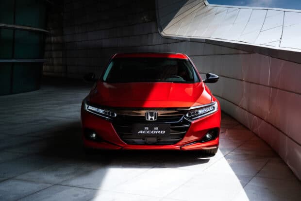 A red Honda Accord is parked in a modern building with light and shadow, 2K Desktop Wallpaper