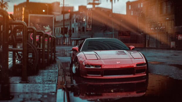 A red Honda NSX is parked on a rainy urban street reflecting city lights and surroundings, 4K Desktop Wallpaper