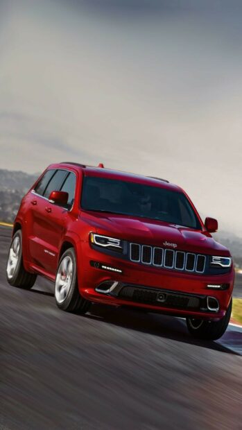 A red Jeep Grand Cherokee shows power and style on the race track, HD Phone Wallpaper