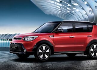 A red Kia Soul car is parked near waterfront with futuristic building in the background, HD Desktop Wallpaper