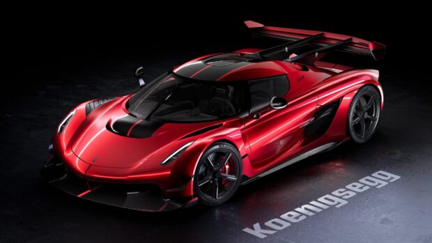 A red Koenigsegg hypercar is showcased with striking black and red details, 2K Desktop Wallpaper
