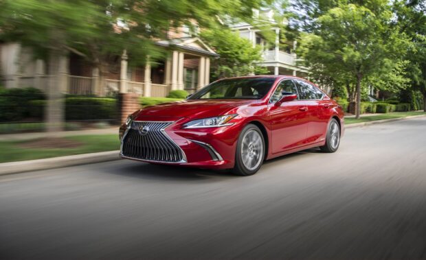 A red Lexus ES is driving fast on a tree lined street in a suburban neighborhood, HD Desktop Wallpaper