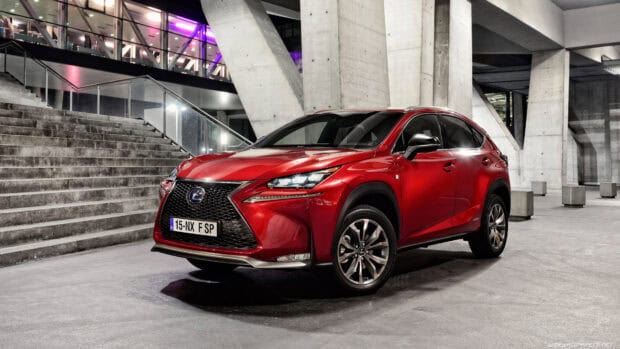 A red Lexus NX is parked near a concrete staircase inside a modern building, 4K Desktop Wallpaper