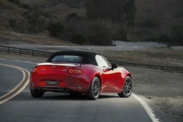 A red Mazda MX 5 Miata is parked on a curvy road surrounded by dry hills, HD Desktop Wallpaper