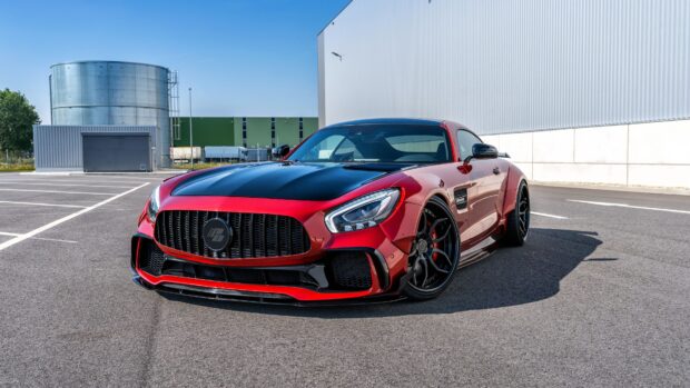 A red Mercedes Benz AMG GT is parked outside with a clear blue sky, 4K Desktop Wallpaper