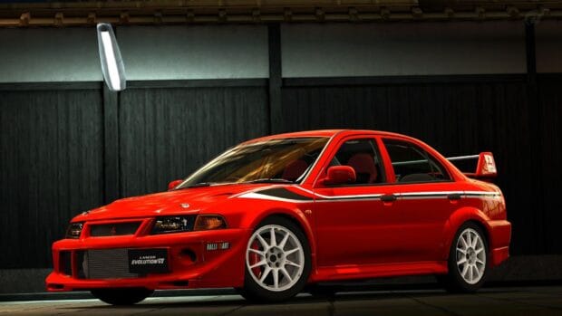 A red Mitsubishi Lancer Evo with white rims parked indoors, HD Desktop Wallpaper