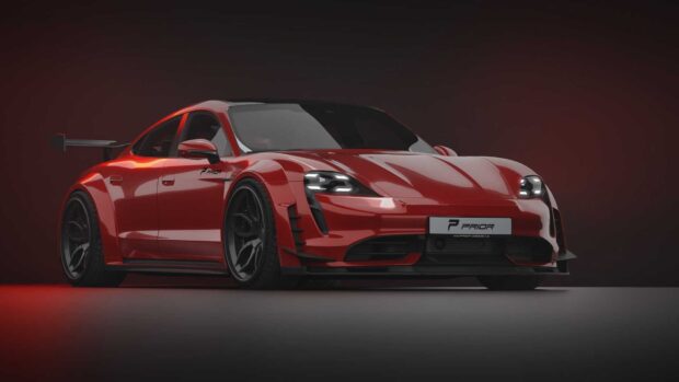 A red Porsche Taycan with a sporty aerodynamic body is showcased on a dark background, HD Desktop Wallpaper