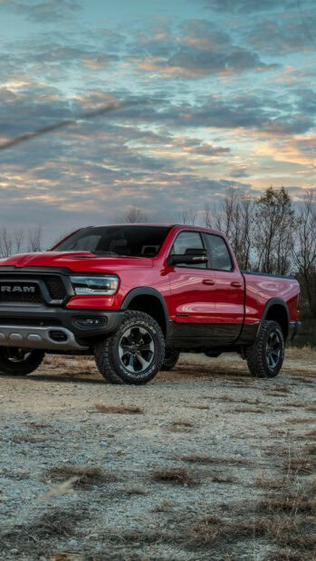 A red Ram pickup truck is parked on a dirt road under a cloudy sky, HD Mobile Wallpaper