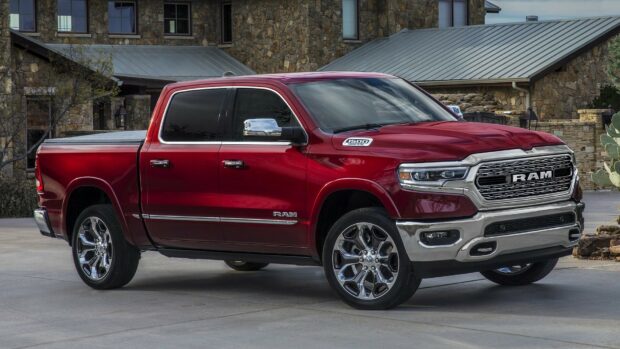 A red Ram truck is parked on a driveway with a stone house background, HD Desktop Wallpaper