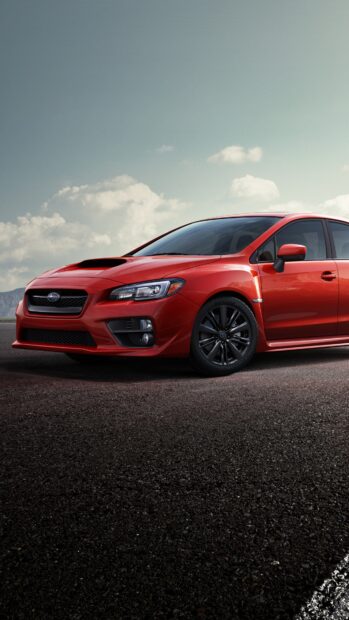 A red Subaru Wrx is parked on an asphalt road with mountains and clouds behind it, 4K Phone Wallpaper