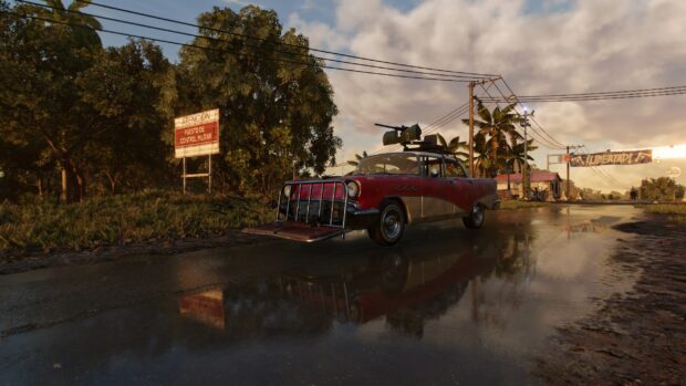 A red vintage car is parked on a rainy street reflecting the village surroundings in Far Cry 6 Wallpapers, 2K Desktop Wallpaper