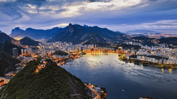 The Rio De Janeiro Wallpapers showcase the city lights around the bay at dusk, HD Desktop Wallpaper