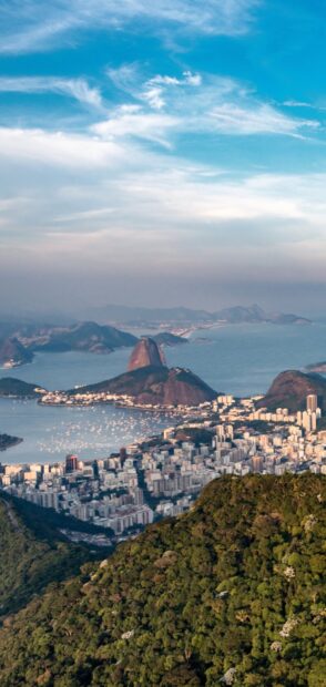 This image shows the stunning Rio De Janeiro cityscape with its iconic mountains and coastline, HD Mobile Wallpaper