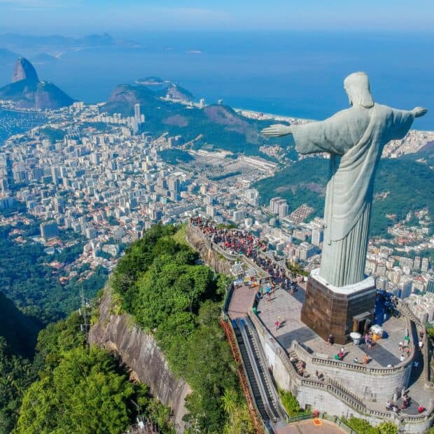 Aerial view of Rio De Janeiro showcases the Christ the Redeemer statue and cityscape with mountains, HD Desktop Wallpaper