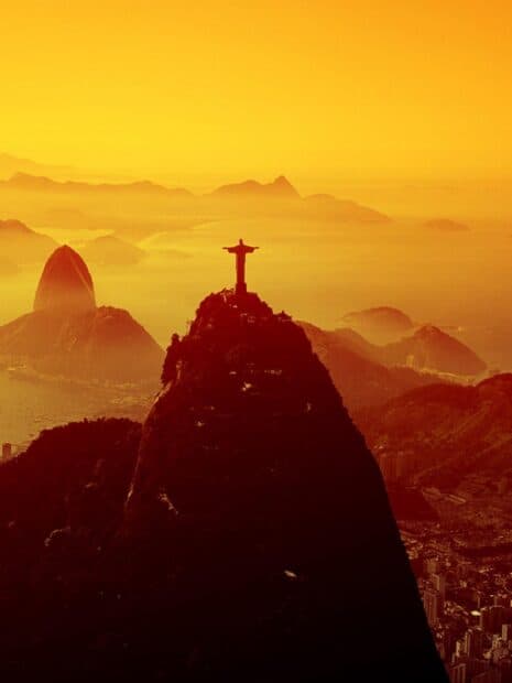 Rio De Janeiro showcases the iconic Christ the Redeemer with glowing orange sky, HD Desktop Wallpaper