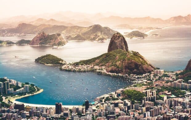 A panoramic view shows Rio De Janerio with Sugarloaf Mountain and the bay, 2K Desktop Wallpaper