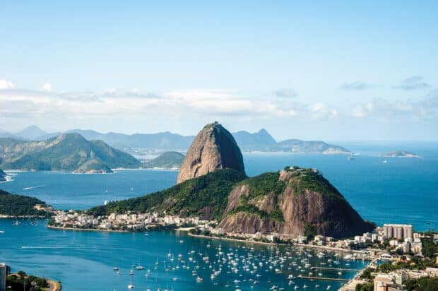 A peaceful view of Rio De Janerio with lush hills and calm waters, 2K Desktop Wallpaper