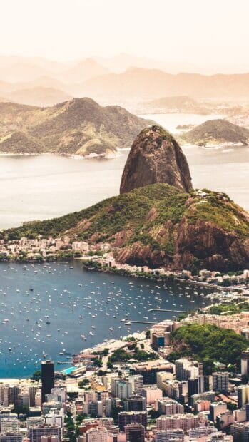 A scenic view of Rio de Janeiro featuring Sugarloaf Mountain and the bay with boats, 4K Mobile Wallpaper