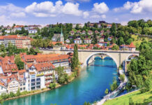 Scenic Swiss city, The River Aare flows past historic buildings and bridges in Bern, Switzerland, HD Desktop Wallpaper