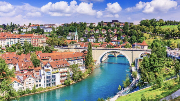 Scenic Swiss city, The River Aare flows past historic buildings and bridges in Bern, Switzerland, HD Desktop Wallpaper