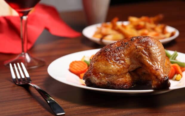 A roasted chicken leg served with mixed vegetables and fries on a white plate, 2K Desktop Wallpaper