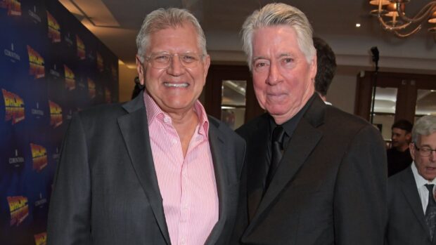 Robert Zemeckis is seen posing with a smiling guest at an event, HD Desktop Wallpaper