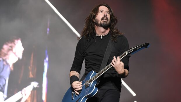 Dave Grohl is performing live with an electric guitar during a concert, HD Desktop Wallpaper