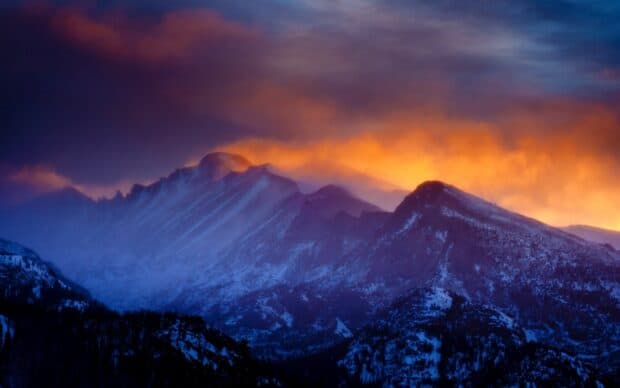 The Rocky Mountain National Park displays a colorful sunset over snow covered peaks, HD Desktop Wallpaper