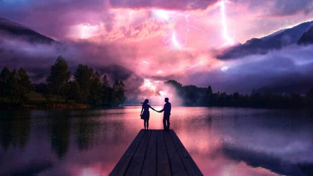 A love couple wallpapers showing a man and woman holding hands on a dock with lightning and pink clouds, 2K Desktop Wallpaper