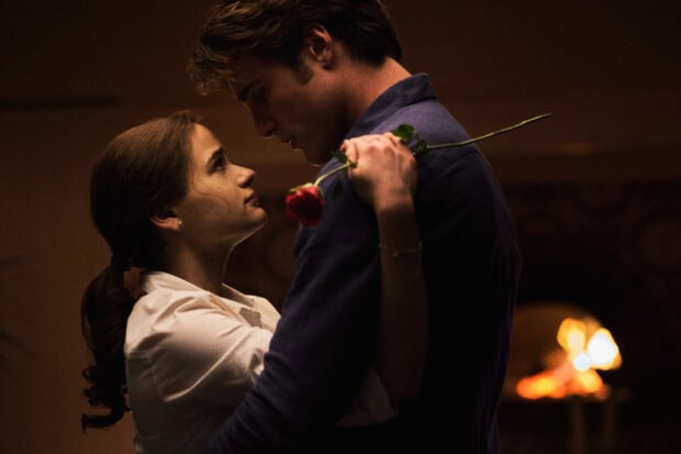 A tender scene features Jacob Elordi holding a woman close with a rose, HD Desktop Wallpaper