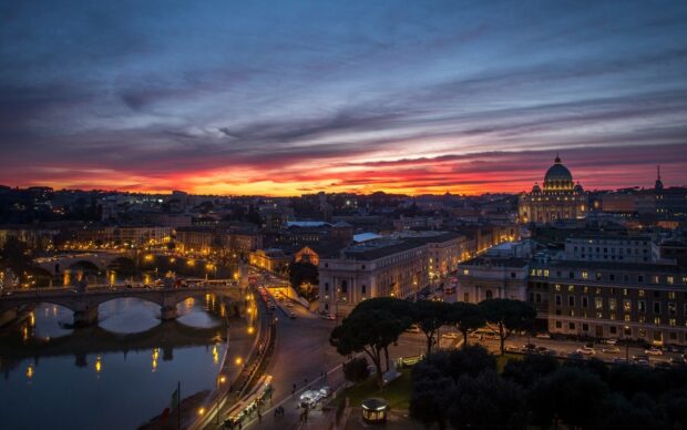 The Rome skyline features historic buildings and river views at sunset, HD Desktop Wallpaper