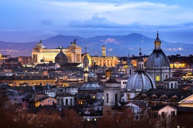 The view of Rome skyline features iconic historic buildings under a twilight sky, HD Desktop Wallpaper